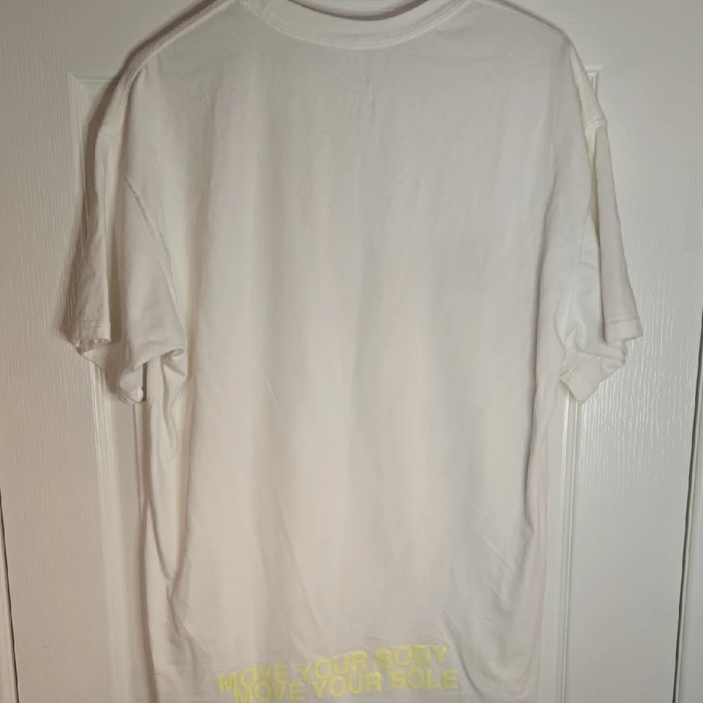 Nike World Tour White T-Shirt with Blue and Orange‎ Graphics